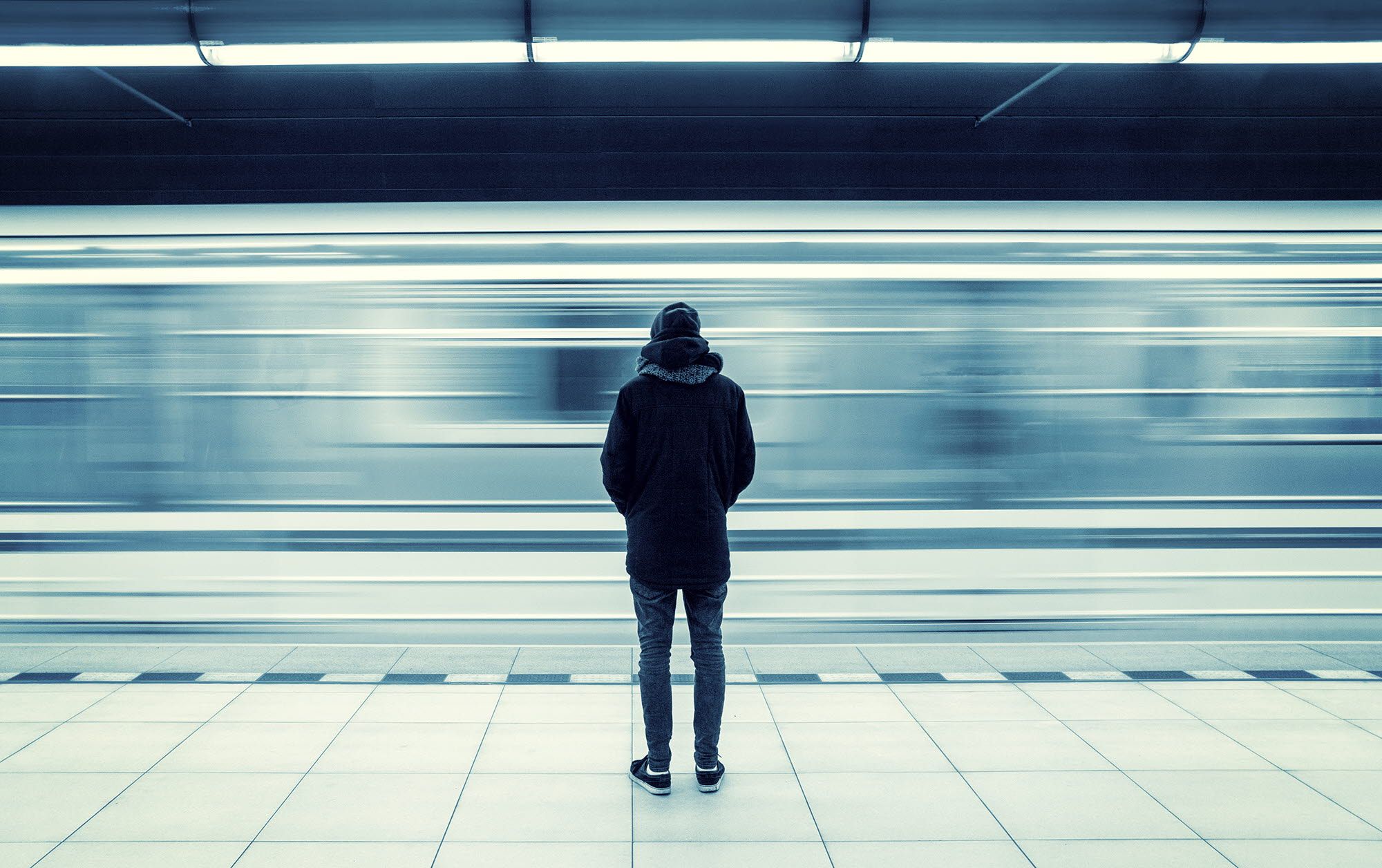 Man standing in front of a speeding train